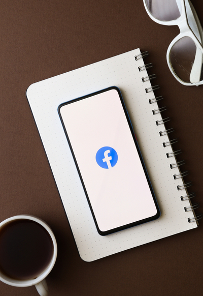 Facebook Advertising Guide 2021 - Phone With Facebook Icon